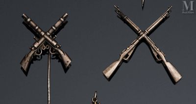 three different types of guns hanging on the wall