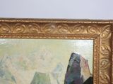 a painting of a mountain in a gold frame