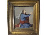 a painting of jesus kneeling on the ground in a gold frame