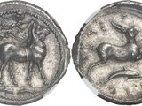 a close up of a coin with a horse and a man on it