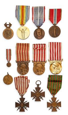 an assortment of medals and medals are displayed on a white surface