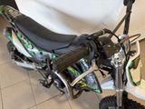 a dirt bike that is sitting on the floor