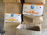 many boxes stacked on top of each other in a room