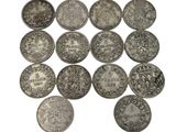an image of a group of silver coins sitting on top of a white surface