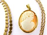 an image of a necklace with a picture of a woman on it