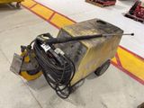 a machine that is sitting on the floor in a warehouse
