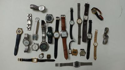 a lot of watches that are laying out on the table