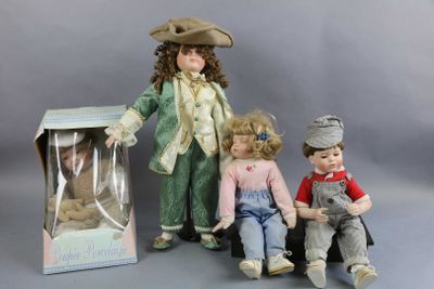 three dolls that are sitting next to each other