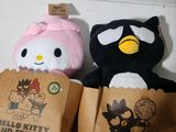 two stuffed animals sitting next to each other on a table