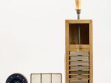 a wooden box with a clock on top of it next to a stack of books