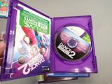 someone is holding a purple case with a dvd inside of it