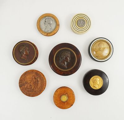 several different types of buttons are arranged on a white surface