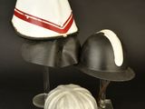 two helmets on top of each other on a black background