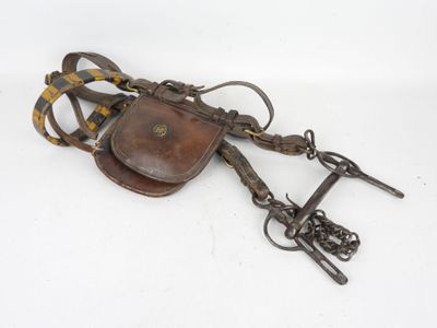 an image of a pair of leather spurs and a leather belt