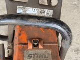an image of a chainsaw sitting on the ground
