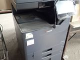 a printer that is sitting on top of a stack of boxes