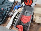 a box of tools sitting on a table next to a box of tools