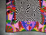 an image of a multicolored scarf on a table