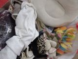 a pile of baby items in a box on the floor