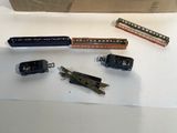 a lot of different types of toy trains on the table