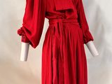 red dress on mannequin base with white background
