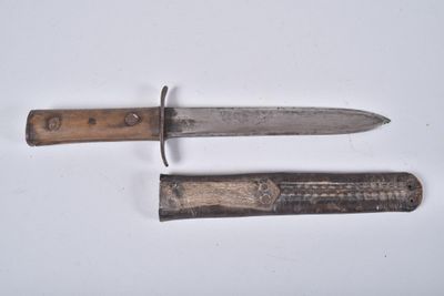 two knives that are laying next to each other on a table