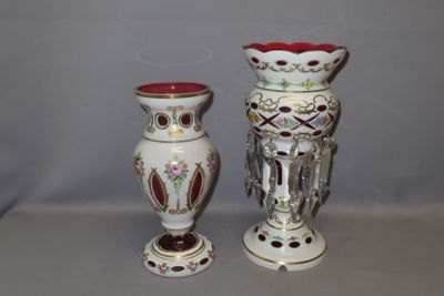 two vases sitting next to each other on a table