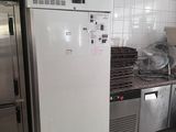 a white refrigerator in a kitchen with a lot of counter space