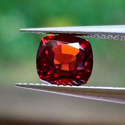 a close up view of a red diamond being cut