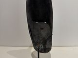 an image of a sculpture of a person ' s head on a stand