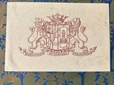 a close up of a piece of paper with a coat of arms on it