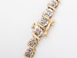 a close up of a diamond bracelet on a white surface