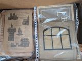 a picture of a box with some paper and a picture of a castle
