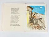 an open book with a picture of a woman and a dog on it