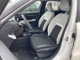 the interior of a car with two black and white seats