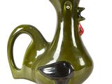 a green vase with a black bird on it