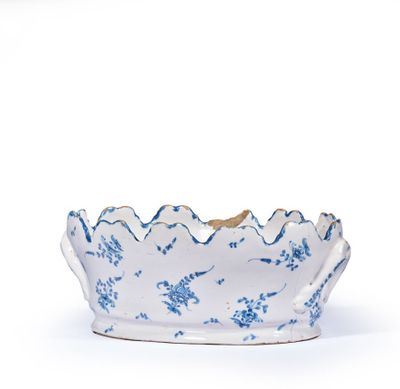 a blue and white bowl on a white surface