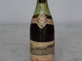 a bottle of wine that is sitting on a table