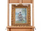 un tableau représentant un homme à cheval, posé sur un chevalet