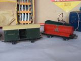 several toy trains are lined up on a table in a room