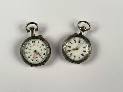 pair of antique pocket watches with roman numerals and roman numerals