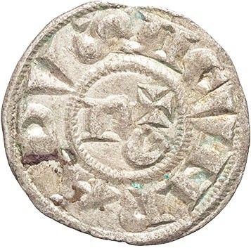 a silver coin with an image of a sun on it