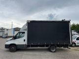 a white truck that is parked in a parking lot