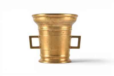 an old brass vase with handles on a white background