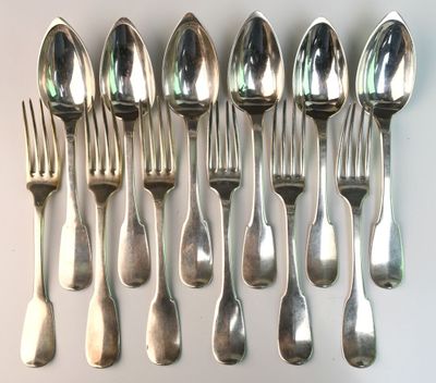 a lot of silver spoons and forks on a table