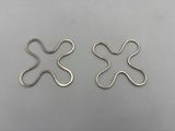 a pair of silver plated earrings with a cross design
