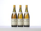three bottles of wine sitting on top of a table next to each other