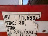 a red and white sign on the side of a red and white truck
