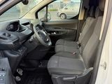 the interior of a white van with the door open