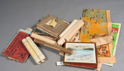 a pile of old books and papers on a table